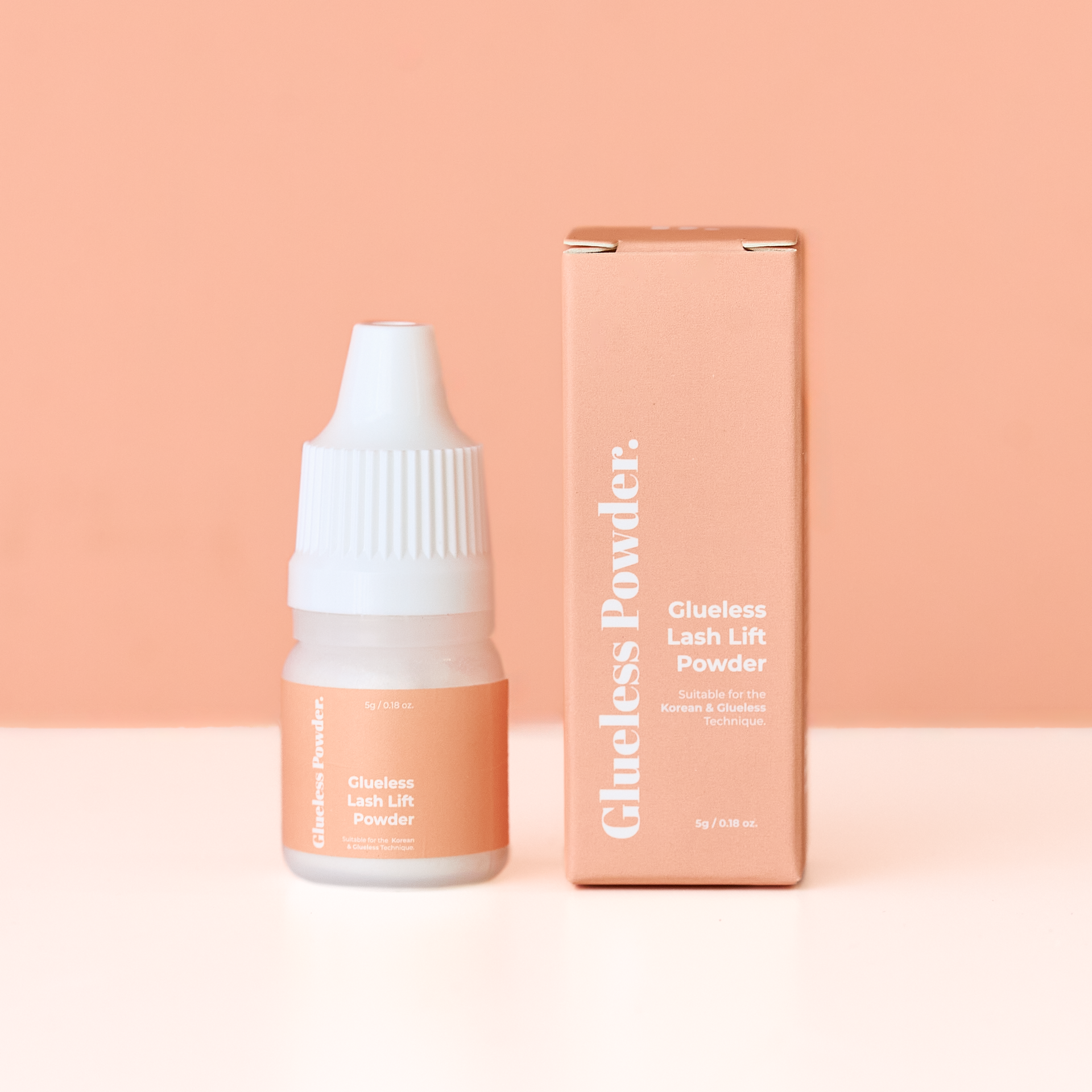Glueless Lash Lift Powder bottle and packaging on a peach background